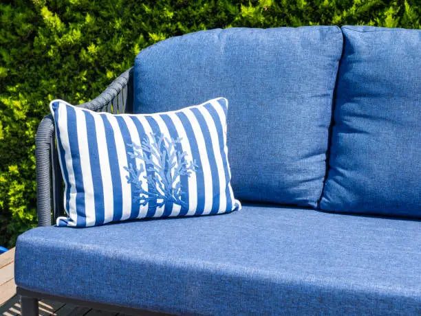 Elegant Blue Outdoor Sofa with Nautical Cushion